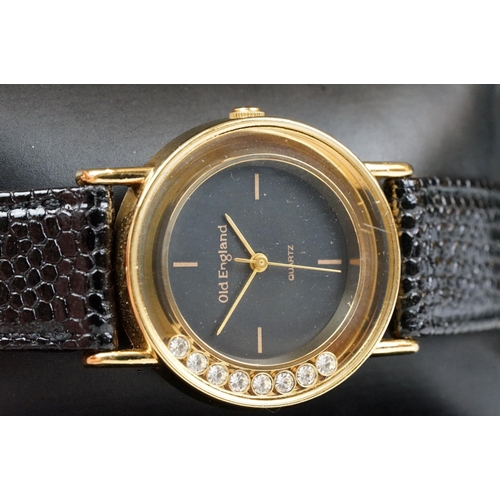 218 - A contemporary Old England quartz wristwatch with black dial, complete with display case.