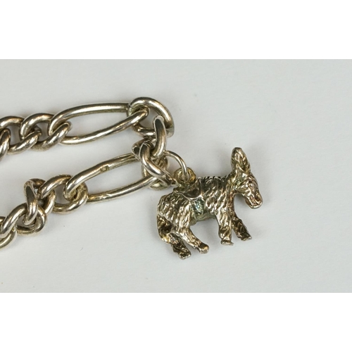 229 - A sterling silver charm bracelet together with six charms in the form of different animals.