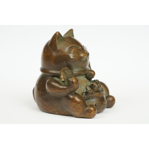 230 - An ornamental Japanese bronze 招き猫 / maneki-neko (waving / beckoning) lucky cat talisman.