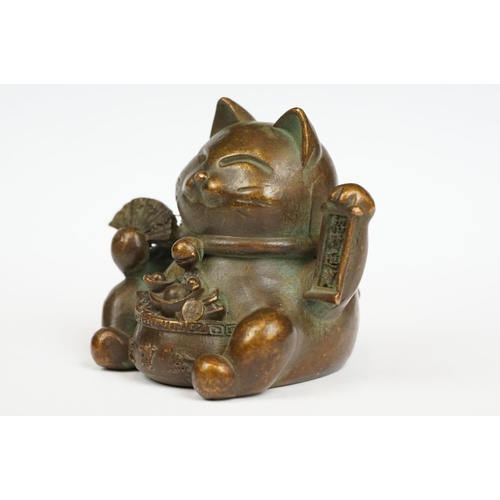 230 - An ornamental Japanese bronze 招き猫 / maneki-neko (waving / beckoning) lucky cat talisman.