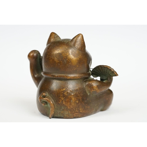 230 - An ornamental Japanese bronze 招き猫 / maneki-neko (waving / beckoning) lucky cat talisman.