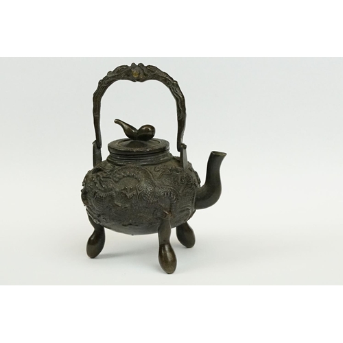 231 - A Chinese bronze miniature teapot.