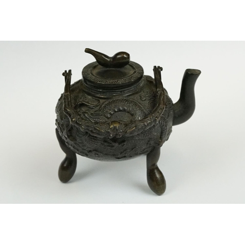 231 - A Chinese bronze miniature teapot.