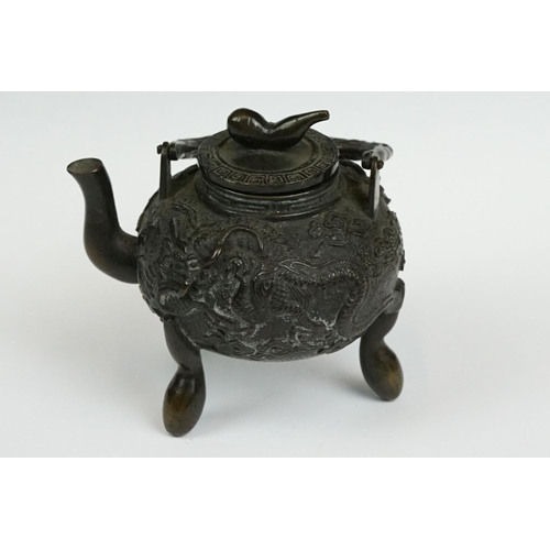 231 - A Chinese bronze miniature teapot.