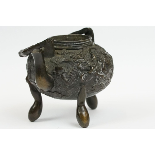 231 - A Chinese bronze miniature teapot.