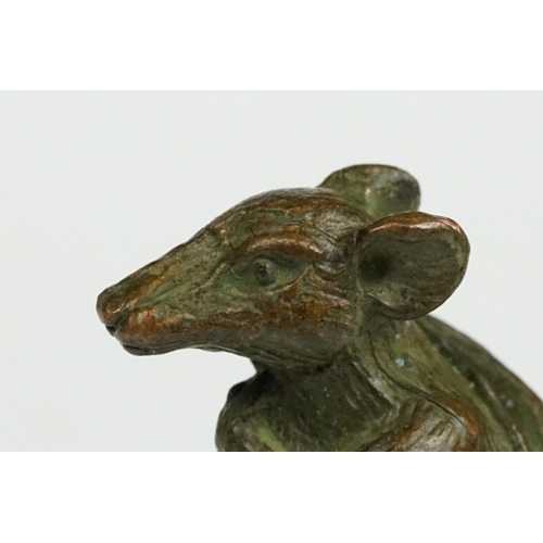 233 - An ornamental Solid brass lucky fortune rat with bag.