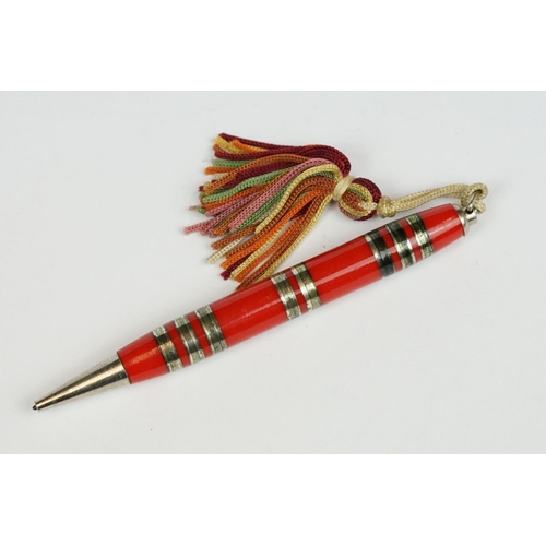 235 - A set of four Bridge propelling pencils with tasseled ends.