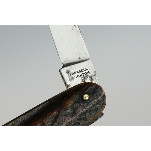 239 - A collection of three vintage pocket knives to include a hallmarked silver cased example.