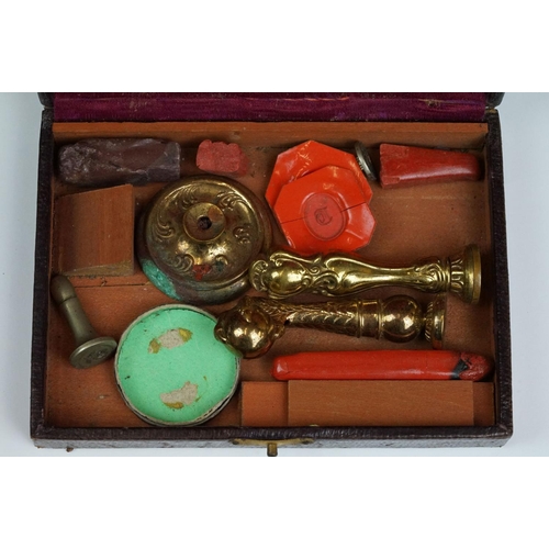 241 - A collection of antique wax seals and taper wax.