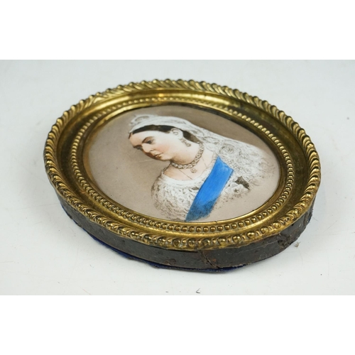 243 - An antique oval ceramic portrait of Queen Victoria.