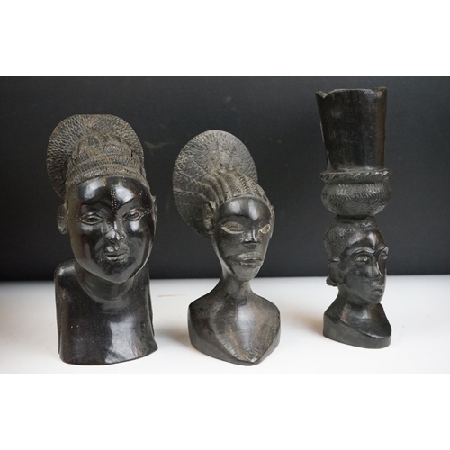 255 - A collection of tribal artefacts from the Congo to include a ceremonial stool and three carved heads... 