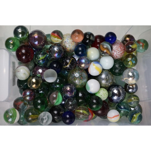 262 - A large collection of glass marbles of varying sizes and colours.