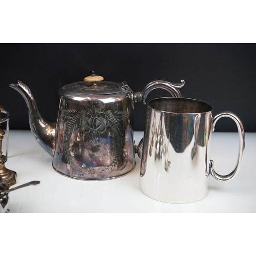 263 - A small collection of mixed silver plate to include teapot, spoons, thimbles, sugar shaker, taper st... 