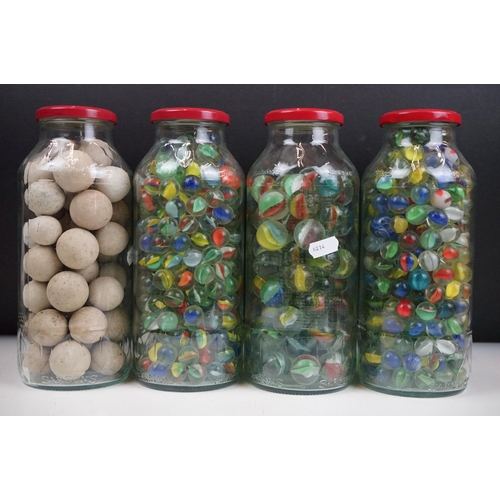 265 - A large collection of mainly glass marbles of varying sizes and colours.