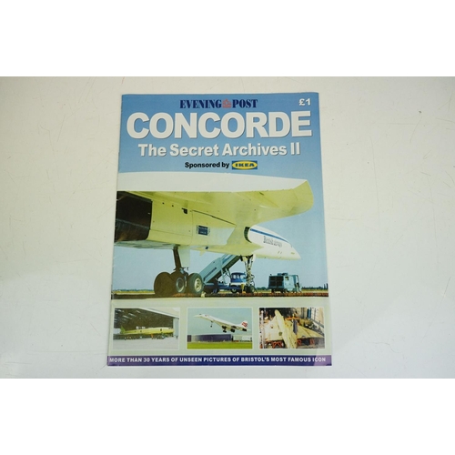 270 - A small group of Concorde collectables to include glass paperweight, tea towel and magazine together... 