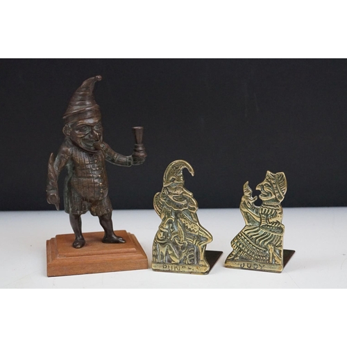 278 - A small group of Mr. Punch collectables to include a hallmarked silver pin dish, small brass bookend... 