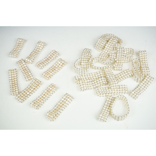 280 - A collection of approx twenty five natural pearl stretch bracelets.