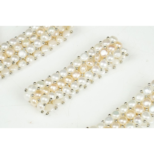 280 - A collection of approx twenty five natural pearl stretch bracelets.