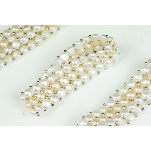 280 - A collection of approx twenty five natural pearl stretch bracelets.