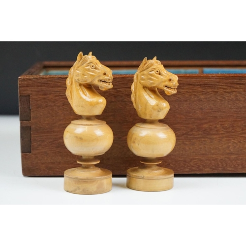 290 - A mid 20th century boxwood chess set in wooden slide top box.