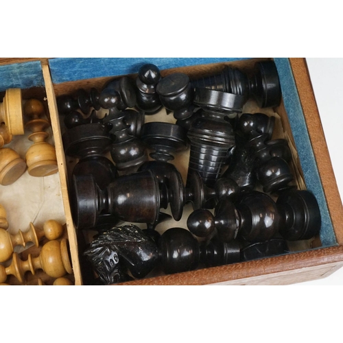 290 - A mid 20th century boxwood chess set in wooden slide top box.