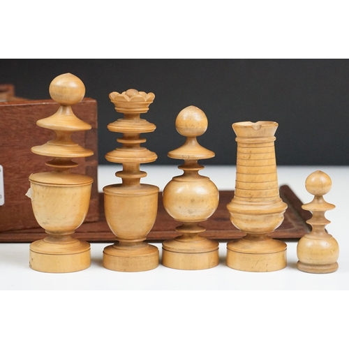 290 - A mid 20th century boxwood chess set in wooden slide top box.