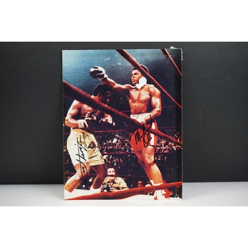 294 - Photograph of a Boxing Match between Muhammad Ali and Joe Frazier, bearing two signatures, photo mea... 