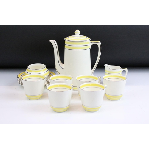 30 - Art Deco Crown Ducal coffee set having a yellow striped design with silver gilt details. To include ... 