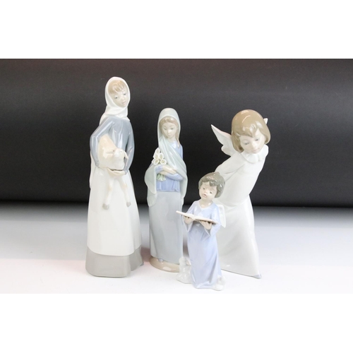 32 - Group of four Lladro figurines to include an angel, girl with lamb, girl with lilies and a boy with ... 