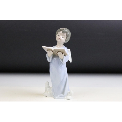 32 - Group of four Lladro figurines to include an angel, girl with lamb, girl with lilies and a boy with ... 