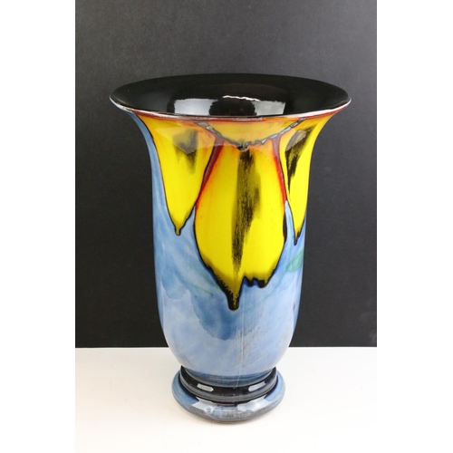 39 - Poole Pottery - Wild Poppy - A large flared rim vase having a blue ground with a large yellow floral... 