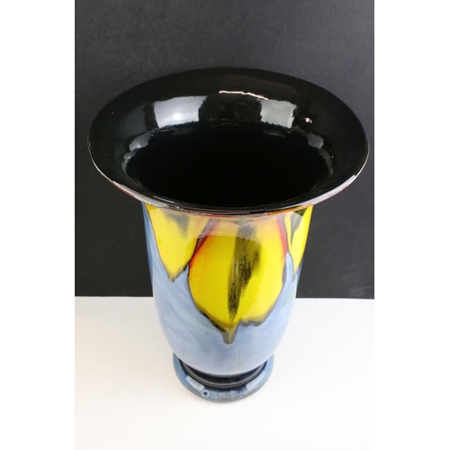 39 - Poole Pottery - Wild Poppy - A large flared rim vase having a blue ground with a large yellow floral... 