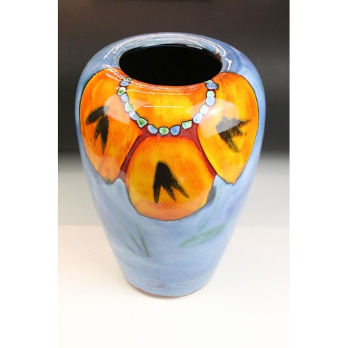 41 - Poole Pottery - Wild Poppy - A drip glaze vase having a blue ground with an orange floral spray to t... 