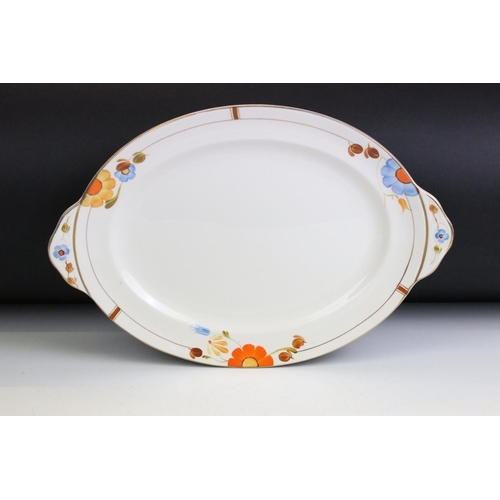 42 - Art Deco Gray's Pottery dinner service having hand painted orange and blue floral decoration. To inc... 