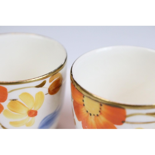 42 - Art Deco Gray's Pottery dinner service having hand painted orange and blue floral decoration. To inc... 