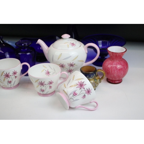 49 - Assorted ceramics to include Shelley pink floral tea set for two, Bristol blue glass, early Royal Do... 