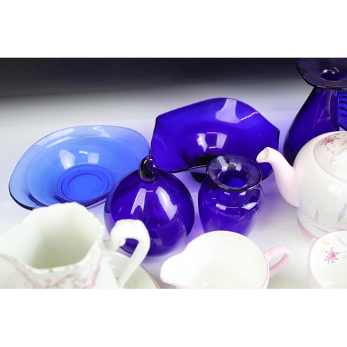 49 - Assorted ceramics to include Shelley pink floral tea set for two, Bristol blue glass, early Royal Do... 