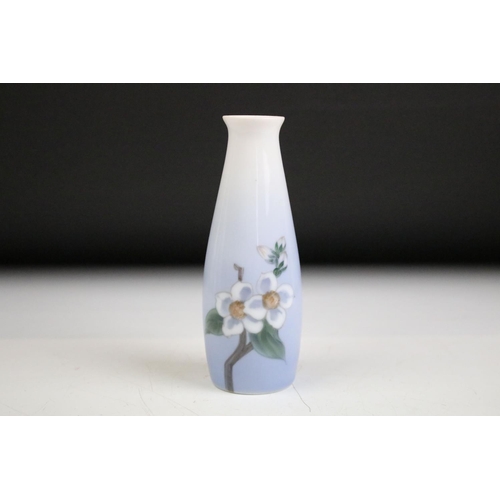 54 - Four Royal Copenhagen vases of varying shapes , each decorated with florals to a blue ground. Togeth... 