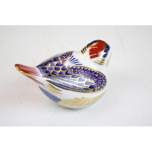 55 - Group of three Royal Crown Derby ceramic paperweights to include two birds with gold stoppers and on... 