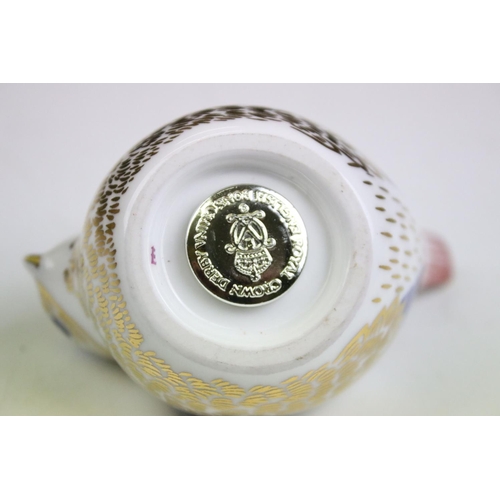 55 - Group of three Royal Crown Derby ceramic paperweights to include two birds with gold stoppers and on... 