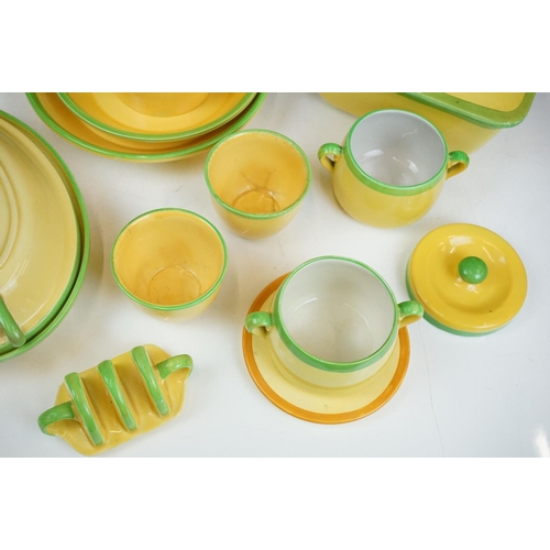 101 - Carlton Ware - A collection of assorted yellow and green ceramics including 'Carlton Ovenware'. The ... 