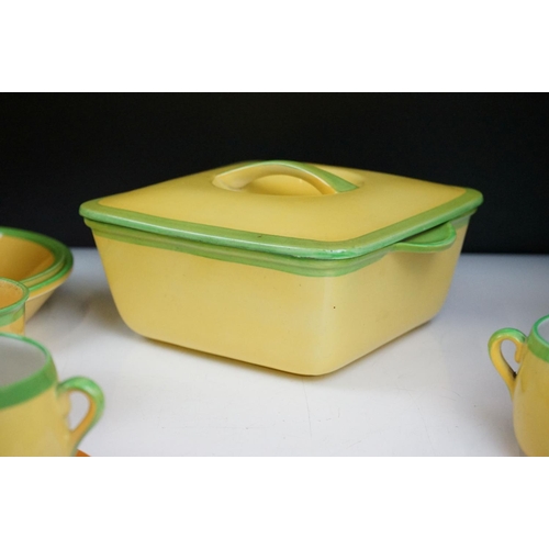 101 - Carlton Ware - A collection of assorted yellow and green ceramics including 'Carlton Ovenware'. The ... 