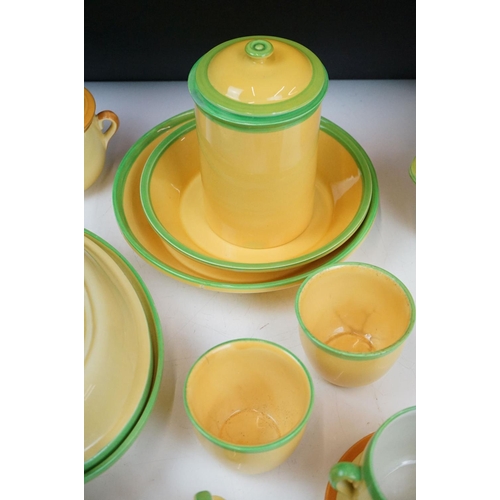 101 - Carlton Ware - A collection of assorted yellow and green ceramics including 'Carlton Ovenware'. The ... 