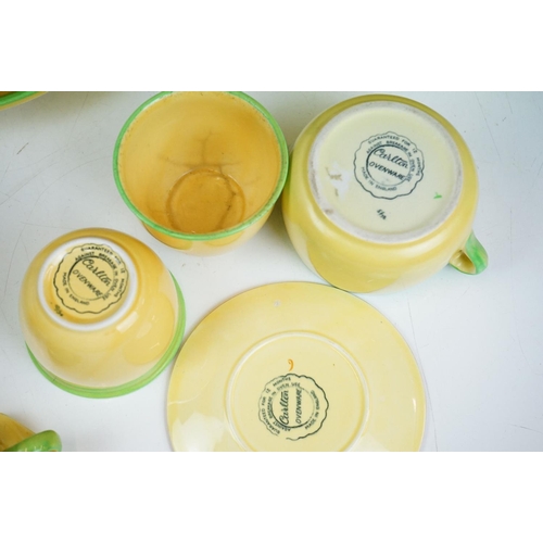 101 - Carlton Ware - A collection of assorted yellow and green ceramics including 'Carlton Ovenware'. The ... 