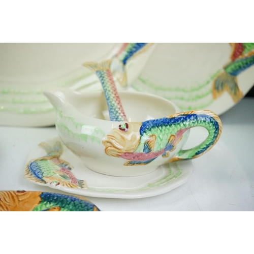 102 - Clarice Cliff for Newport Pottery - Collection of fish pattern ceramics with moulded fish having han... 