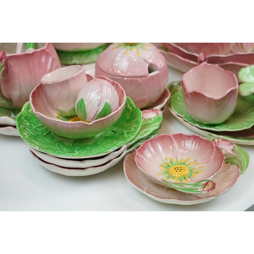 104 - Carlton Ware - Large tea service in the pink buttercup pattern. The lot to include; tea pot, hot wat... 