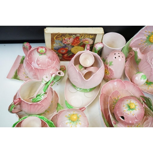 104 - Carlton Ware - Large tea service in the pink buttercup pattern. The lot to include; tea pot, hot wat... 