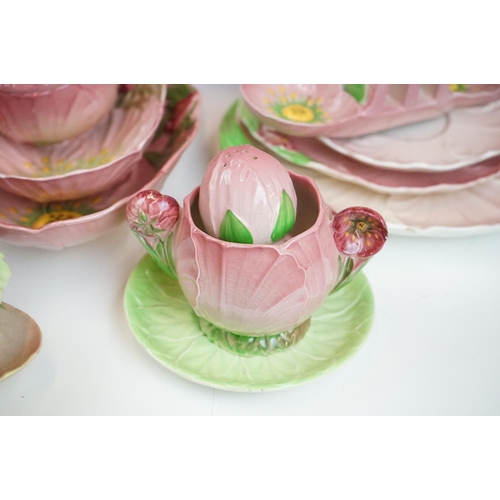 104 - Carlton Ware - Large tea service in the pink buttercup pattern. The lot to include; tea pot, hot wat... 