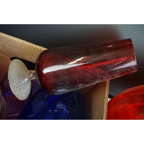 106 - Collection of 20th Century coloured glassware to include cranberry glass vases, blue glass vases and... 