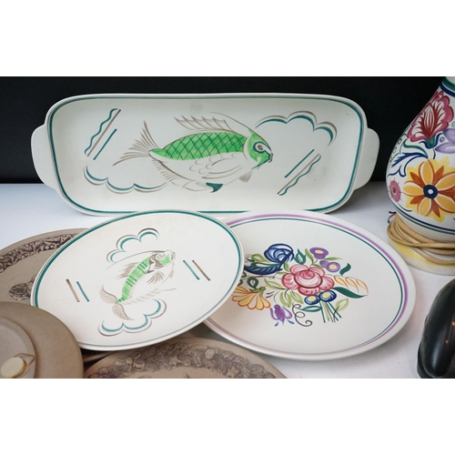 111 - Collection of Poole pottery to include two trout, three dolphins, otter, seal, manitee, matching fis... 